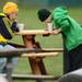 Baseball fans sip hot chocolate during a chilly game against Michigan at Eastern on Wednesday.  Melanie Maxwell I AnnArbor.com